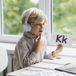 adorable-little-boy-doing-online-session-speech-therapy